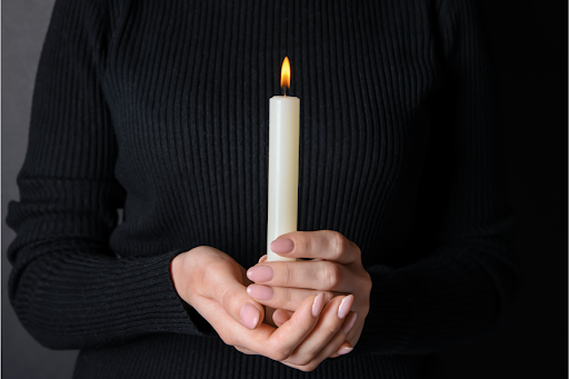 person holding a candle 